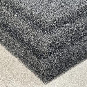Close-up of black Regicell 10 PPI filter foam sheet showing its open-cell porous structure and coarse texture, commonly used for air and liquid filtration applications.